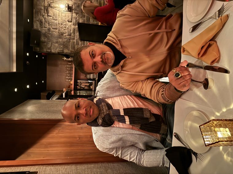 Two EIB teammates sharing dinner at a restaurant